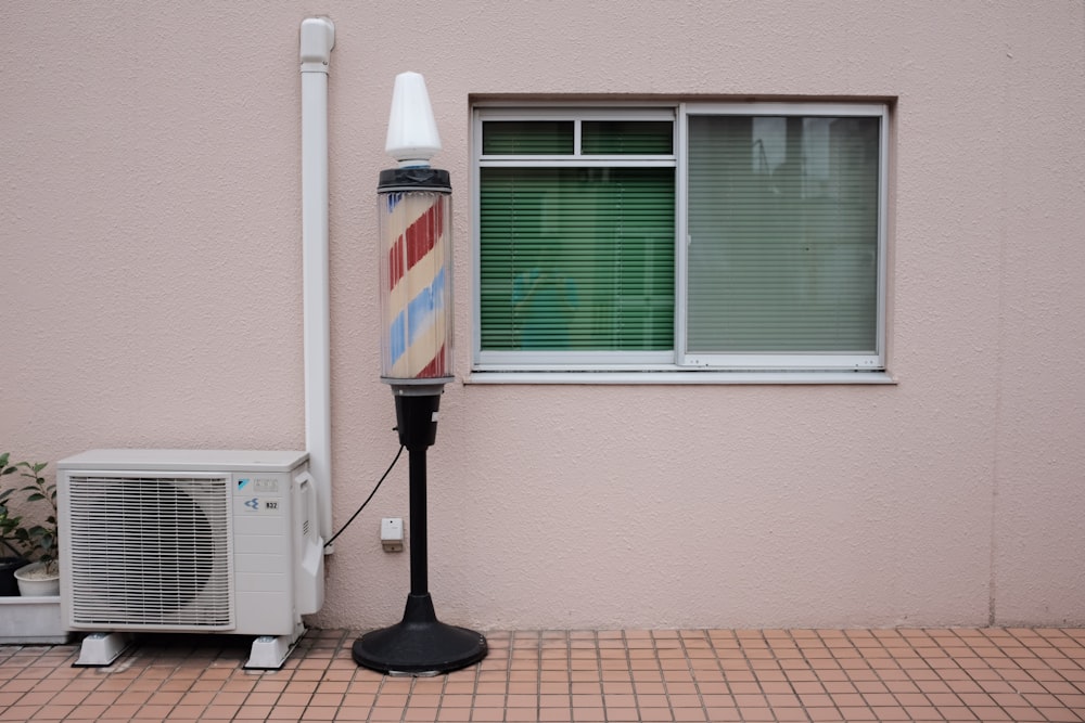 barber's lamp beside air condenser