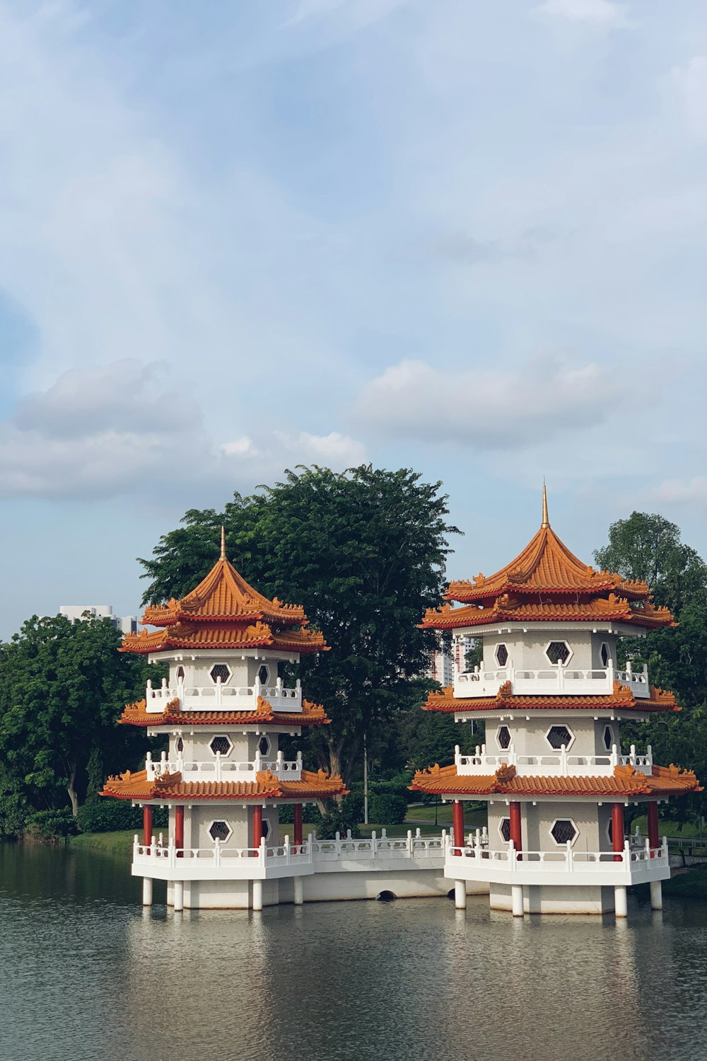 white-and-brown concrete temples on water