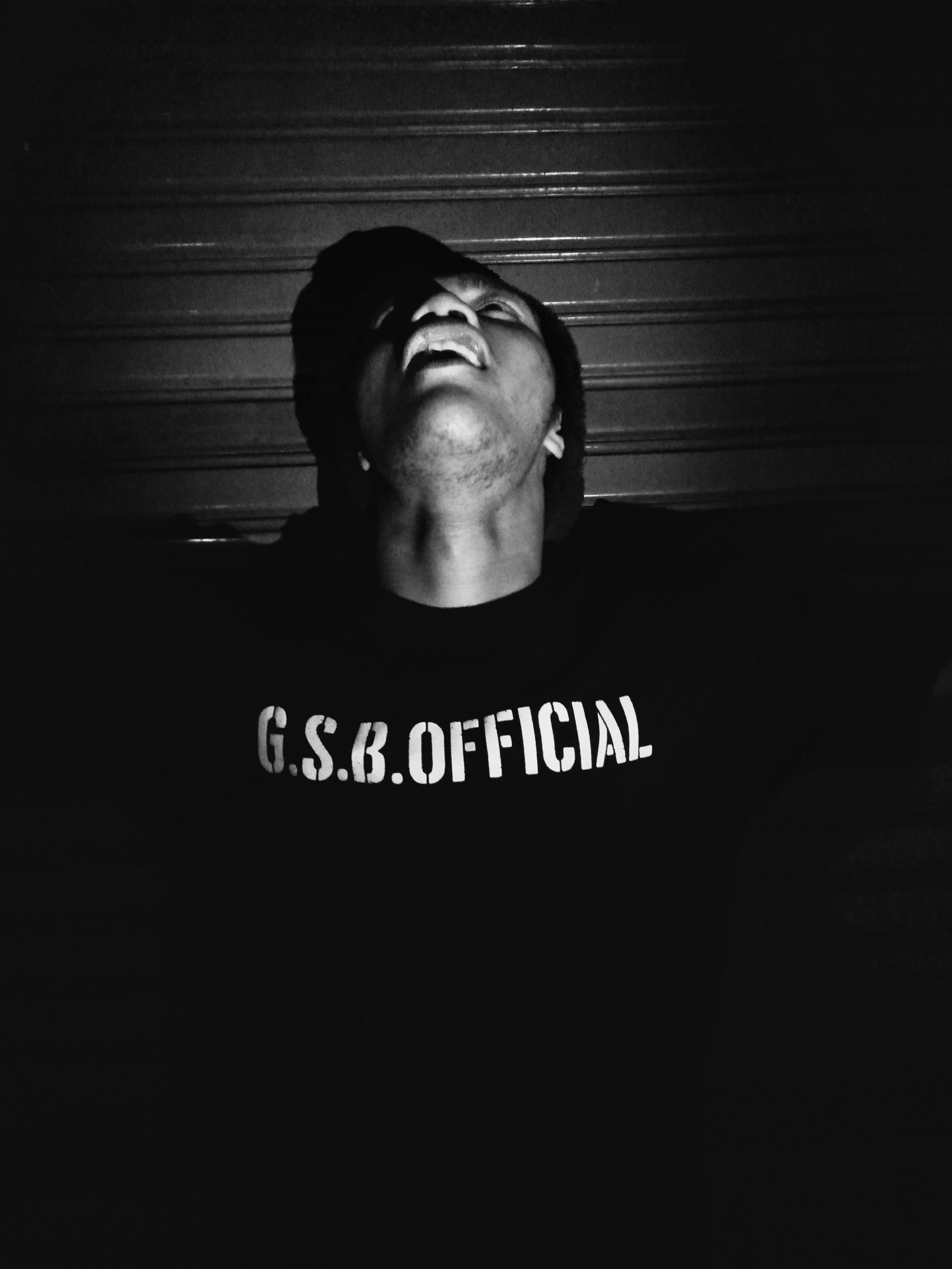 Man looking up in grayscale photo