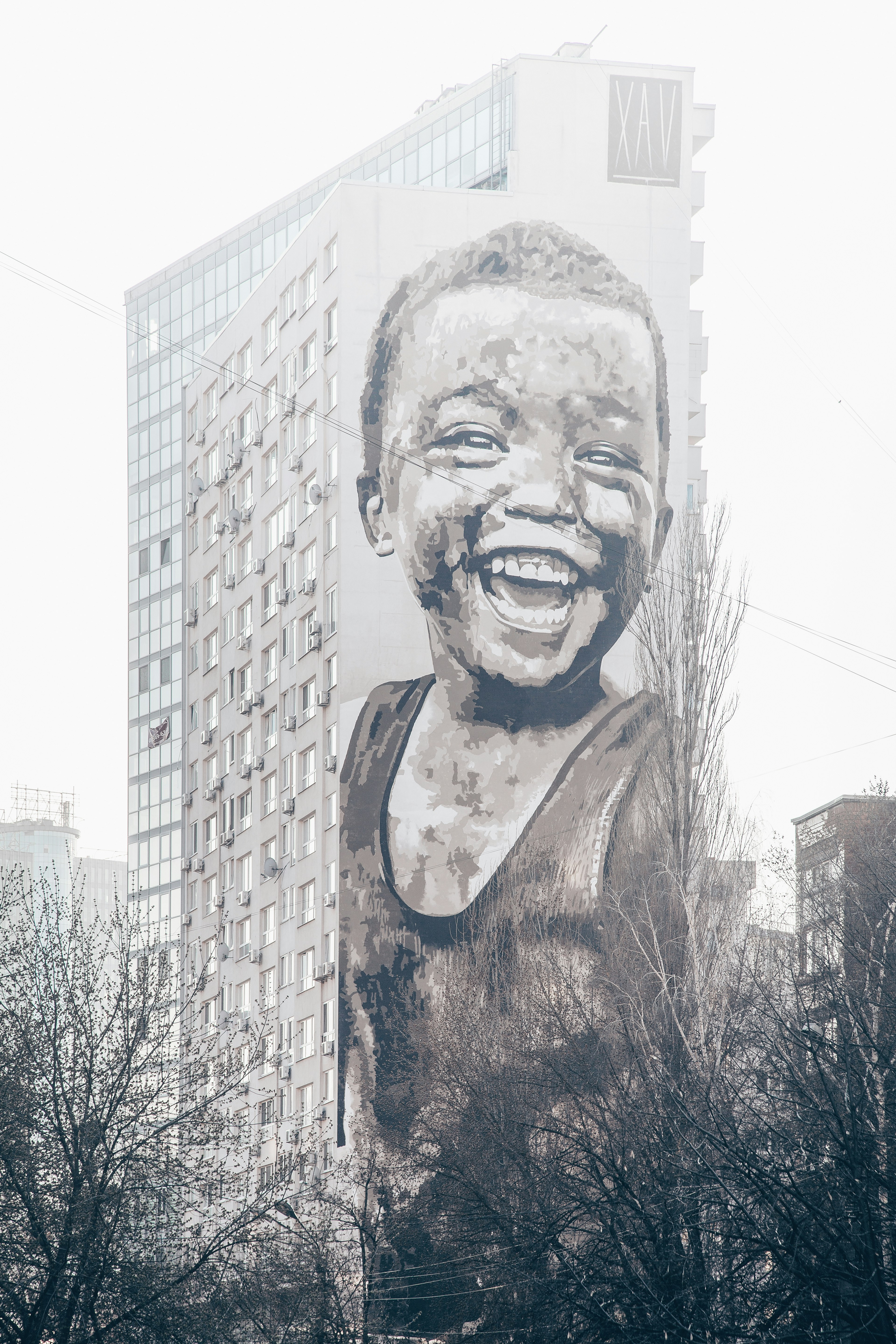 child laughing graffiti art on wall
