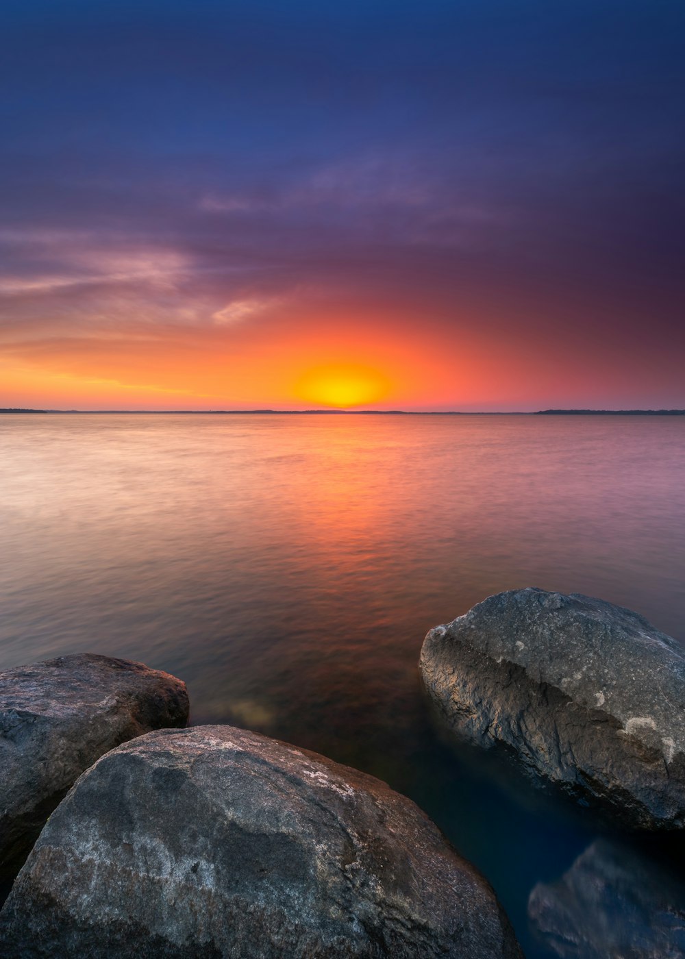 rock formations near sea during sunrise