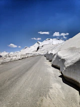 snow covered road during daytime