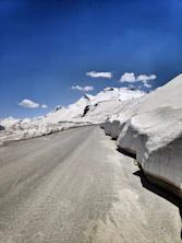 snow covered road during daytime