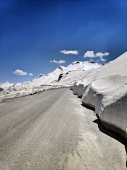 snow covered road during daytime