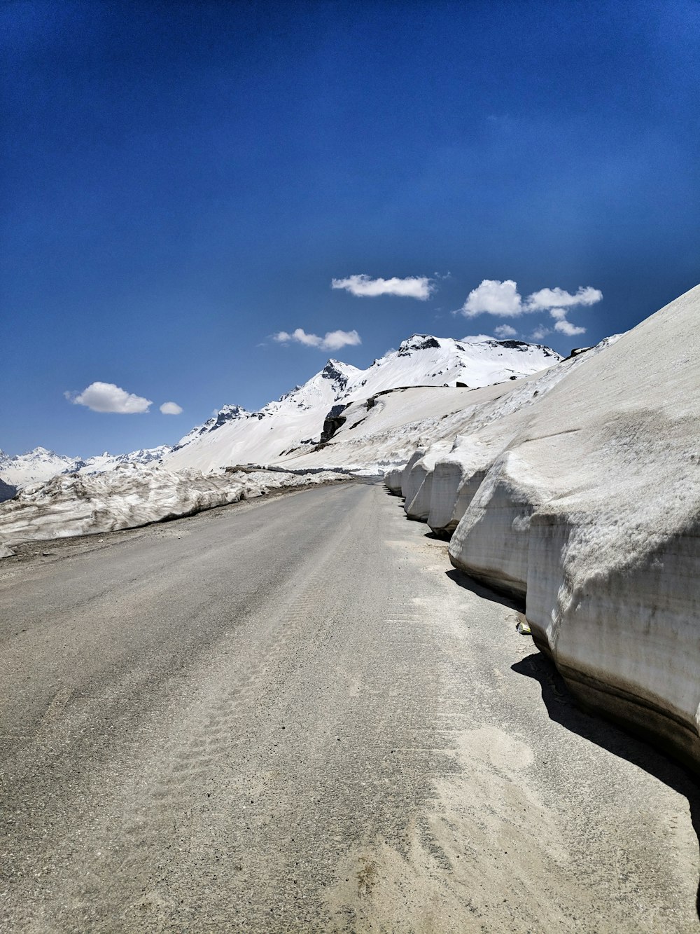 snow covered road during daytime