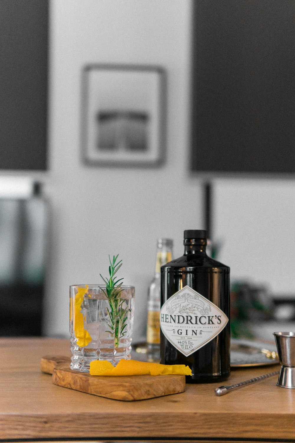 black and white gin bottle on brown wooden table