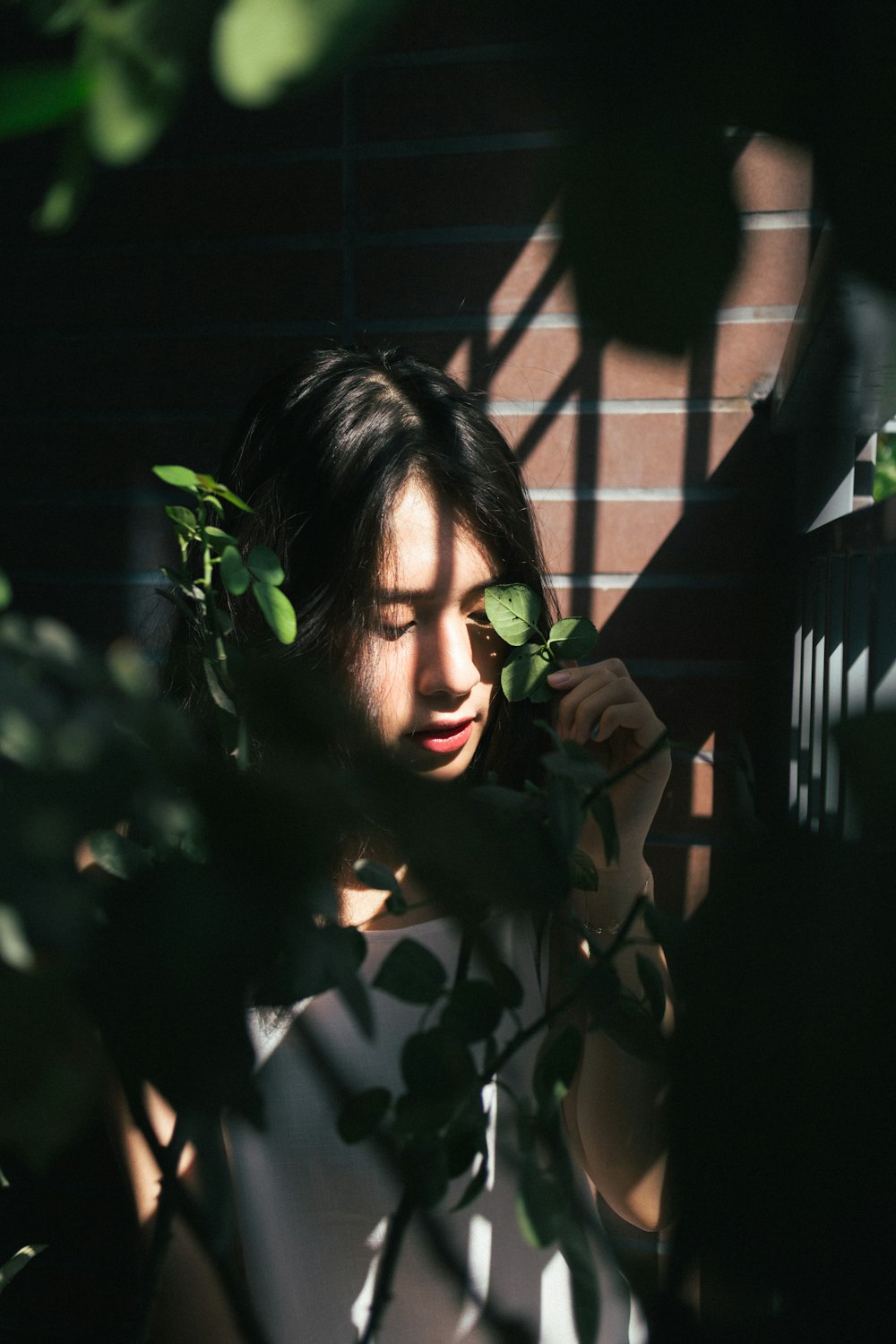 woman holding leaves