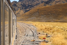 grey metal railway during daytime