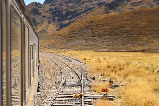 grey metal railway during daytime