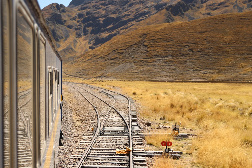 grey metal railway during daytime