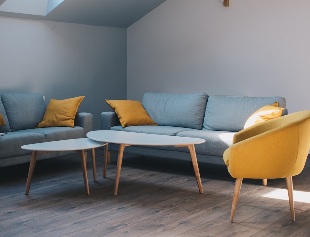 white coffee table and grey fabric sofa