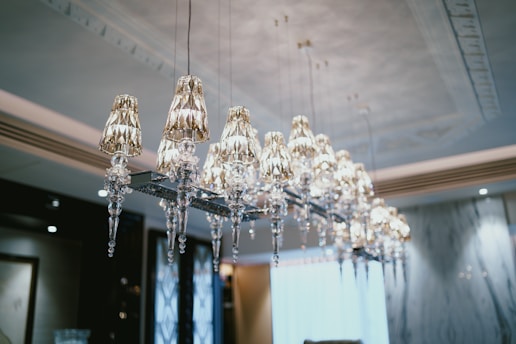 Crystal chandelier in a refined luxury interior, representing London luxury customer experience.