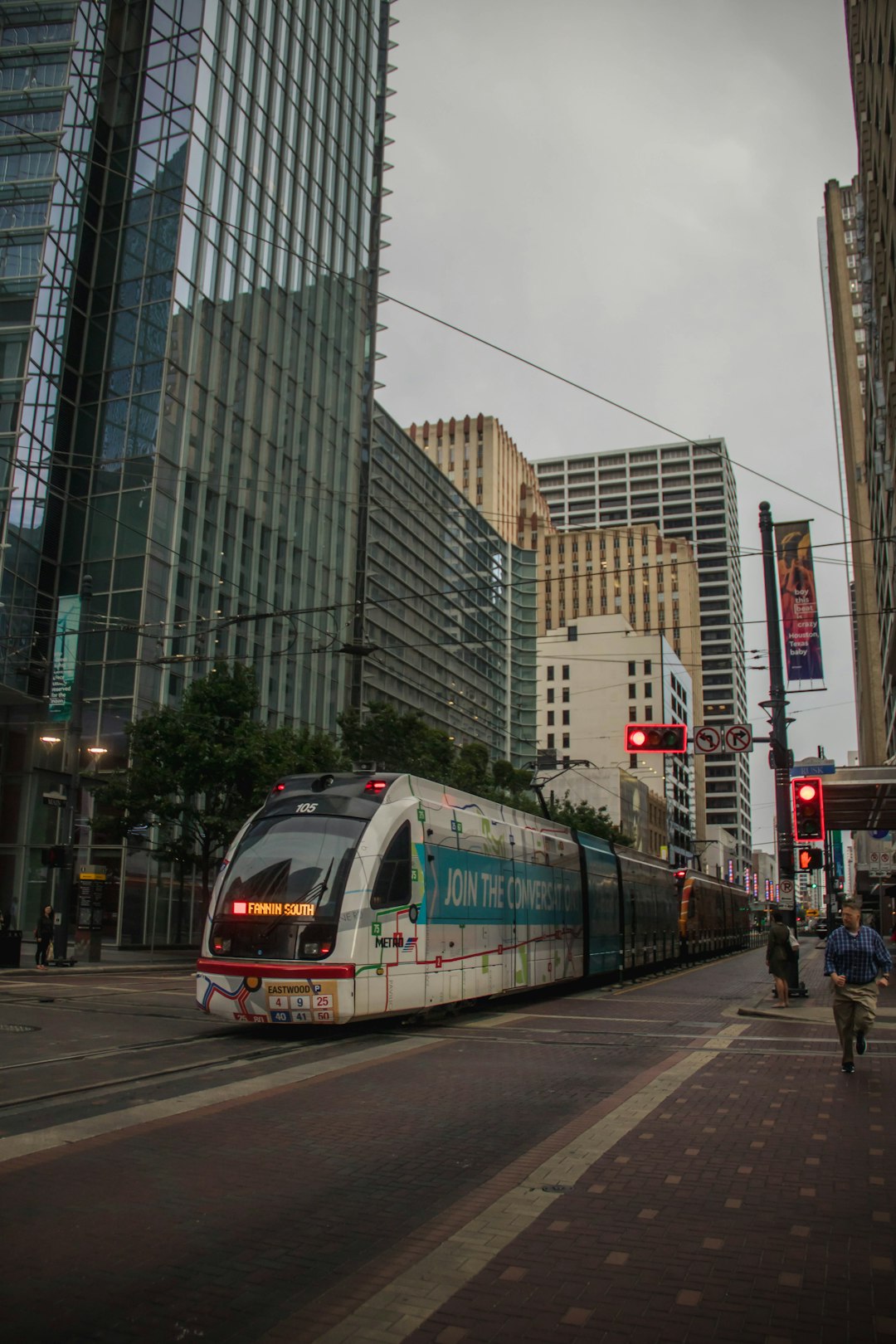 grey train beside buildings