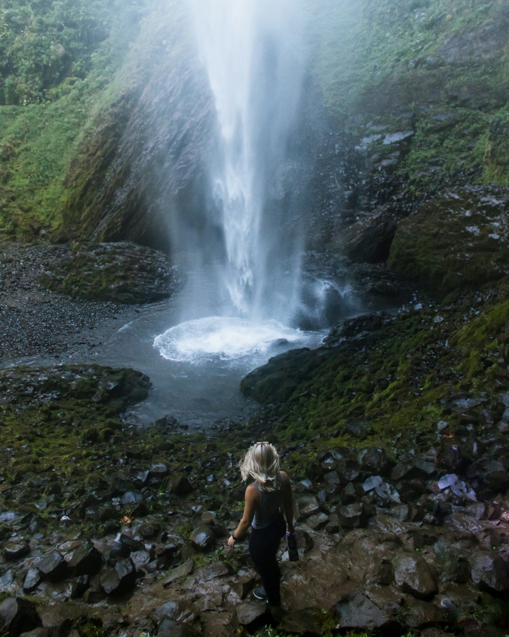 person looking at waterfalls