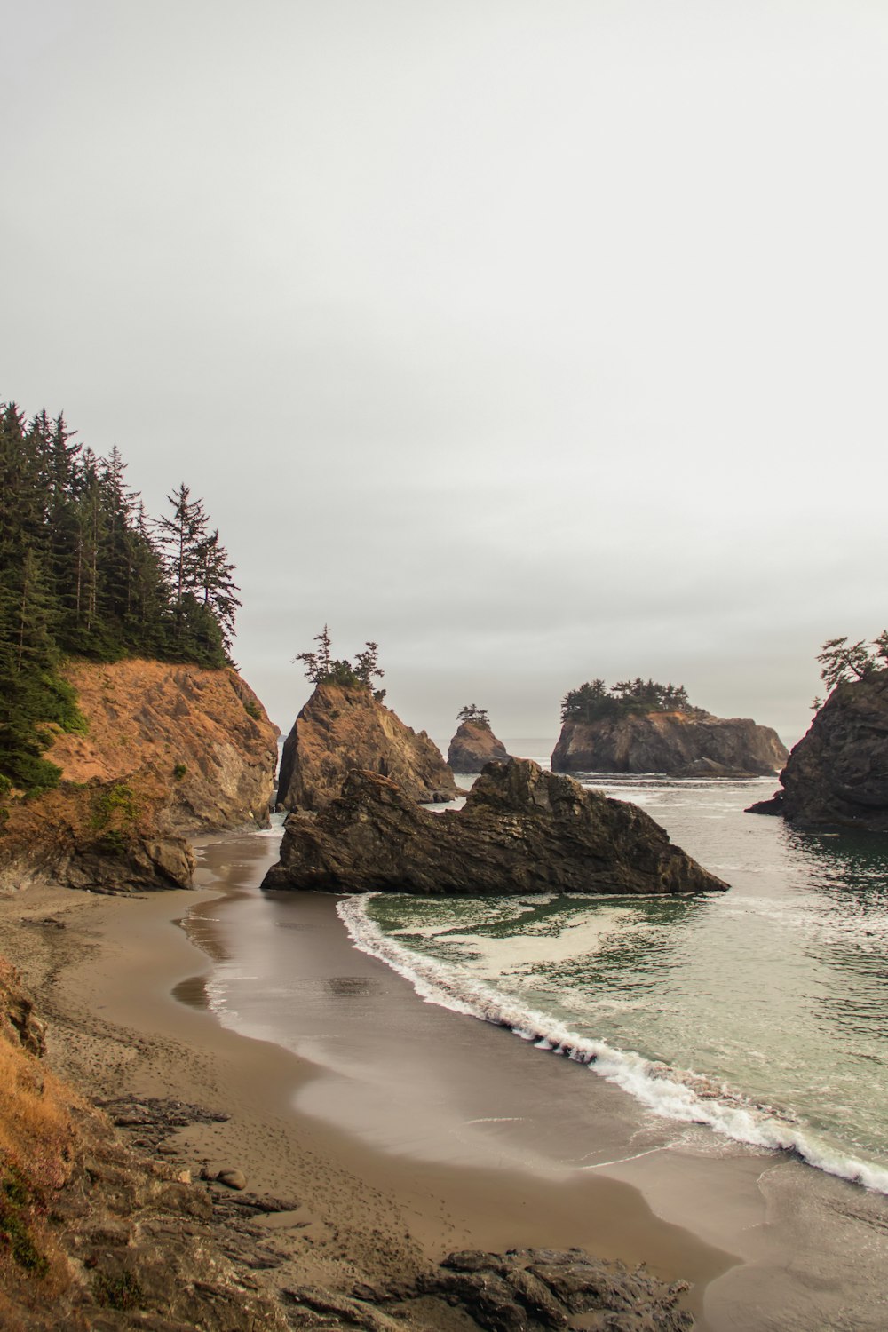 stone formations near ocean during daytime