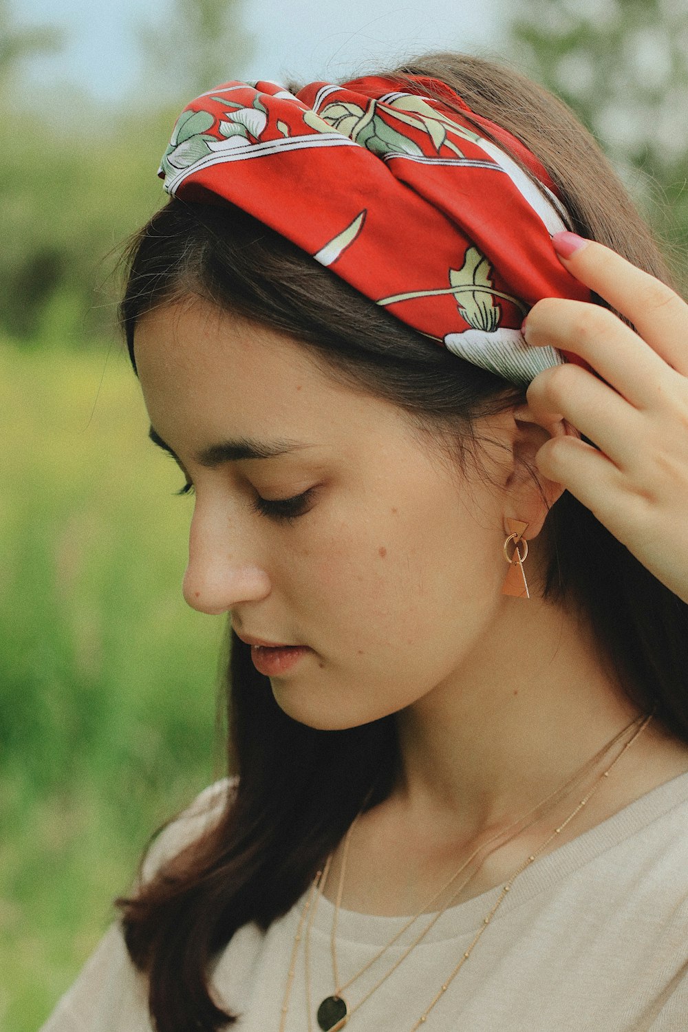 woman wearing red and white floral bandana