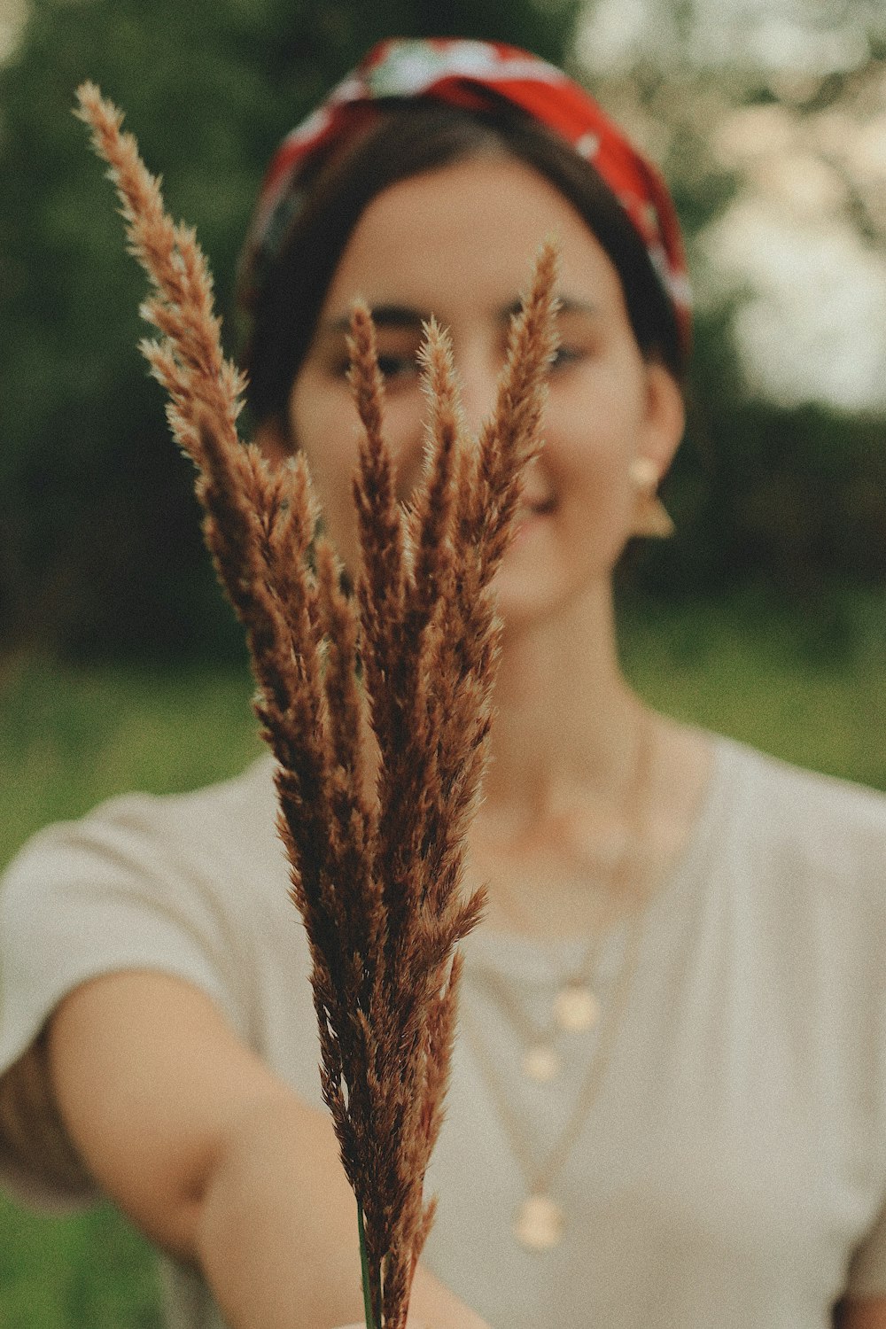 woman holding plant