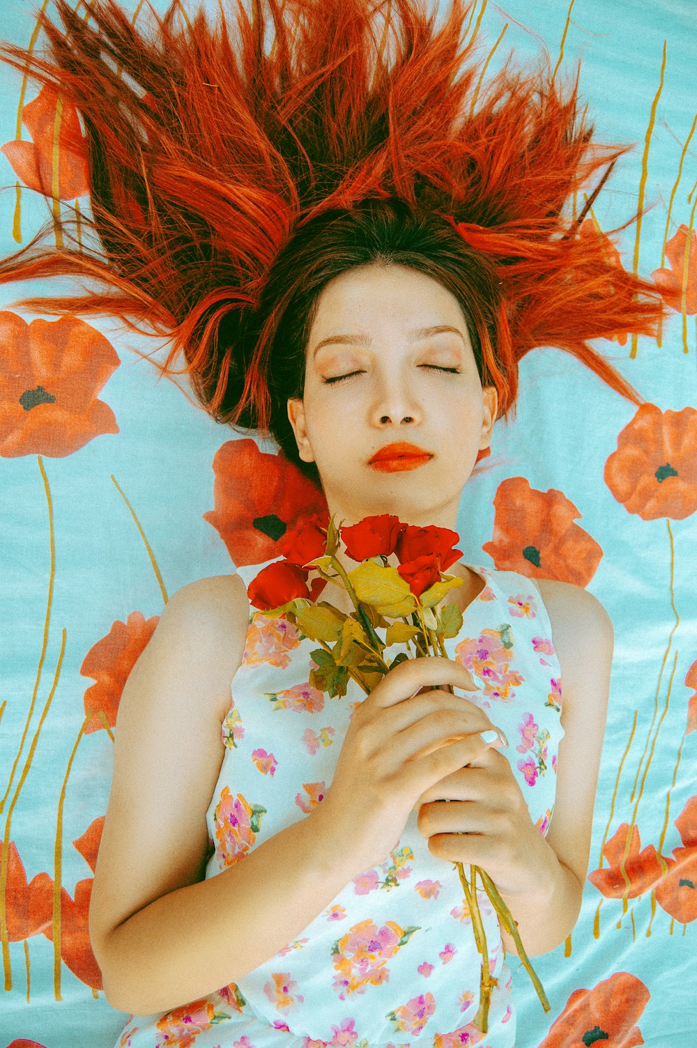 woman holding red roses