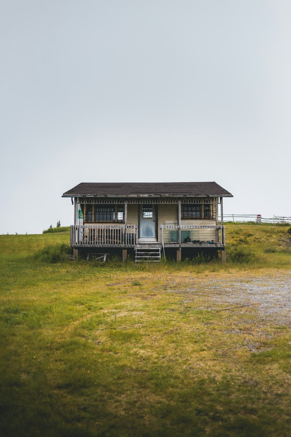 house in the middle of grass