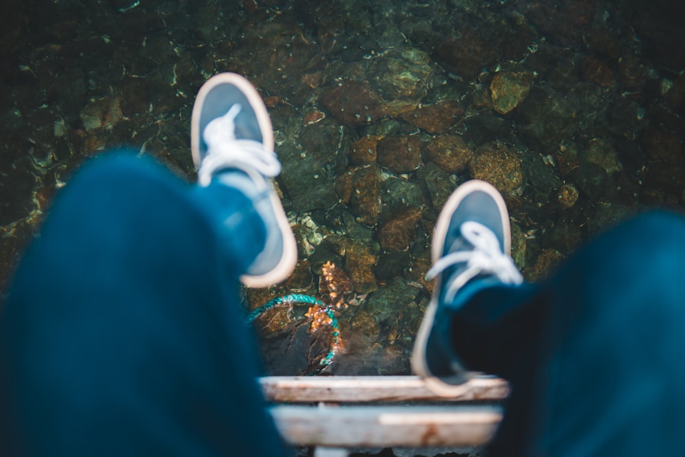 person sitting near water