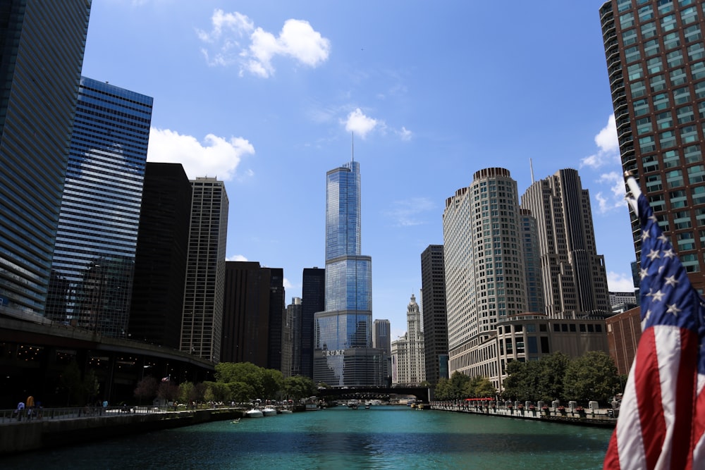 city with high-rise buildings viewing American flag