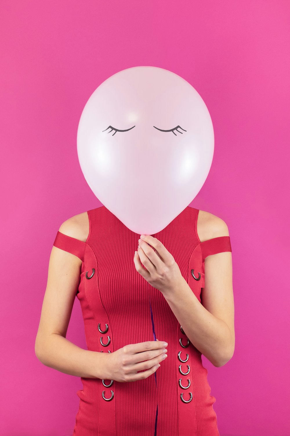 woman holding balloon
