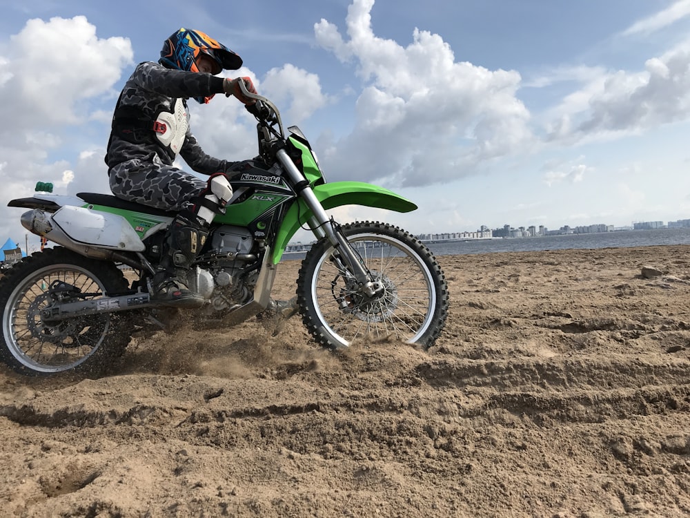 man riding on motocross dirt bike