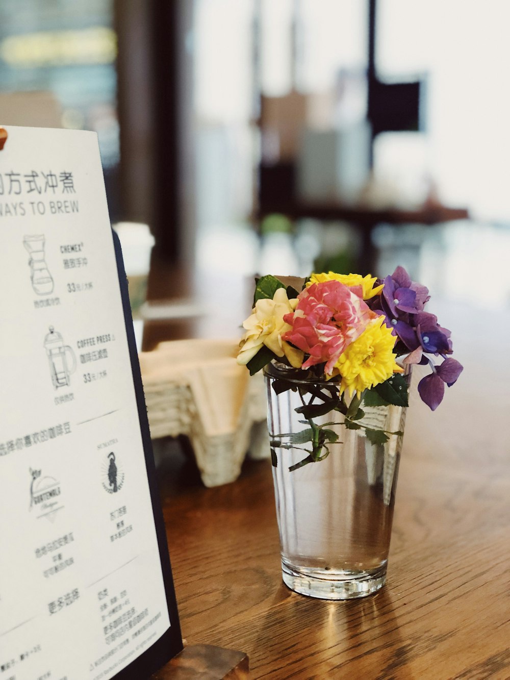 closeup photo of petaled flowers in clear glass