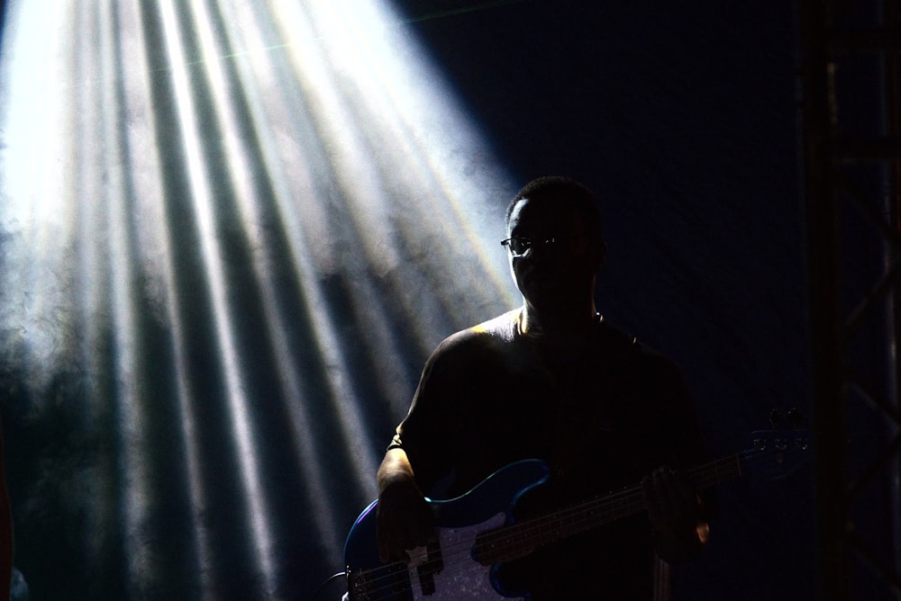 unknown person playing guitar