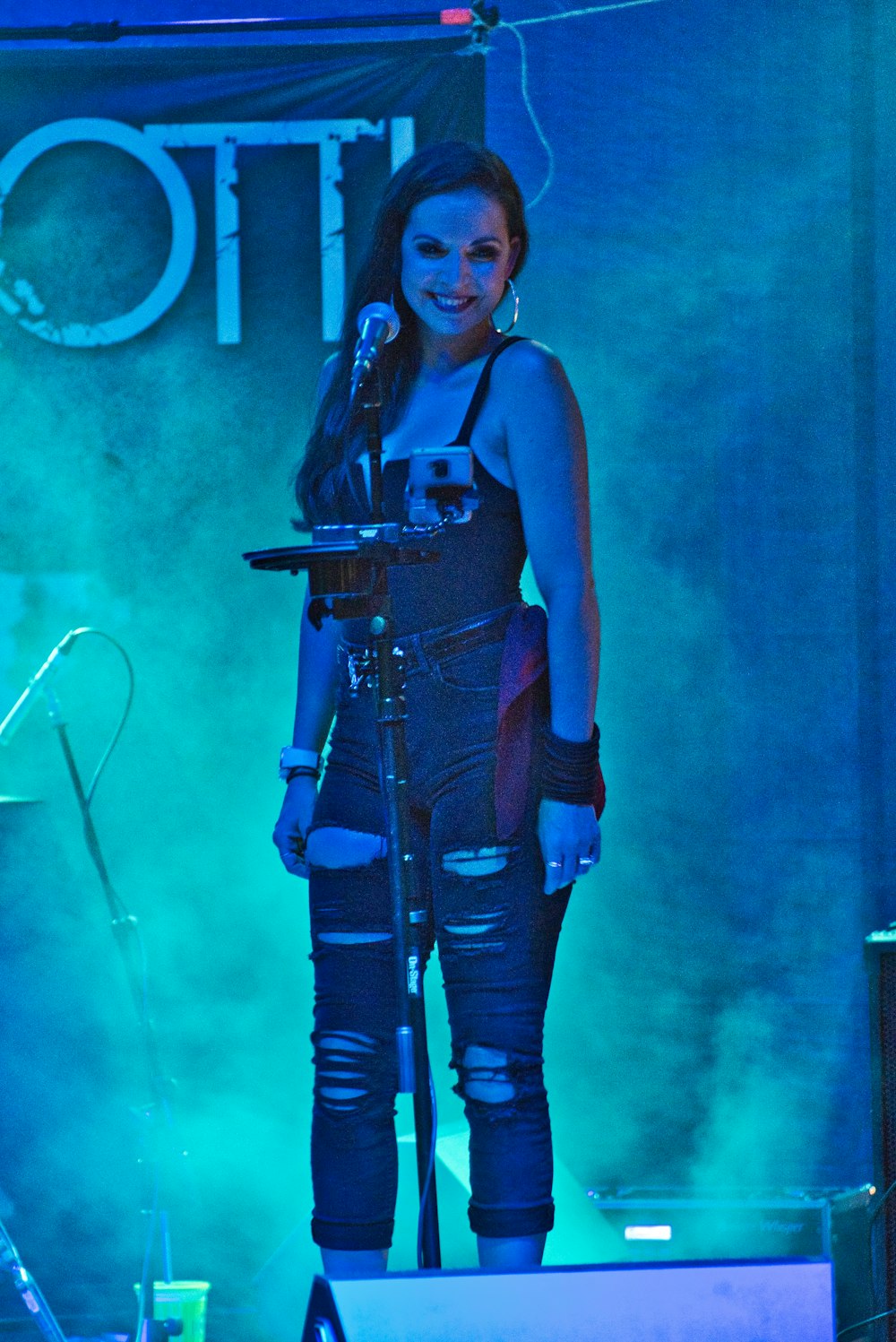 woman standing near microphone