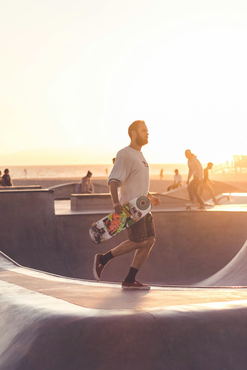 man holding skateboard