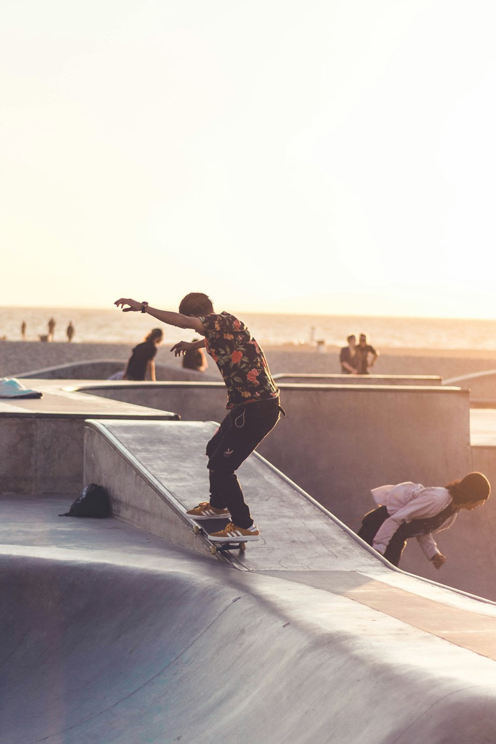 man riding black skateboard