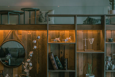 A cozy setup featuring home accessories arranged on a rustic shelf