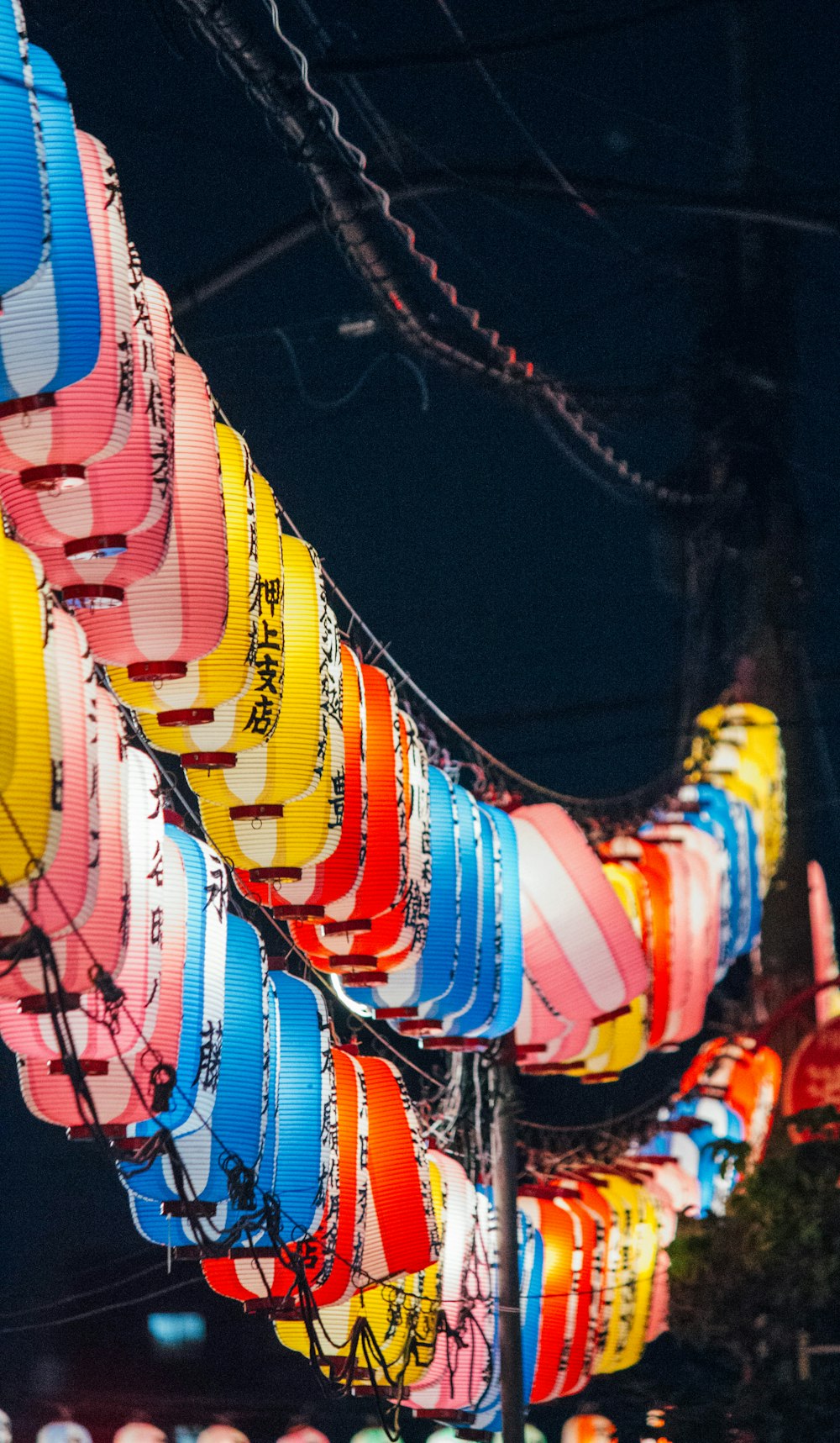 shallow focus photo of lighted lanterns