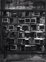 grayscale photography of CRT computer monitor lot