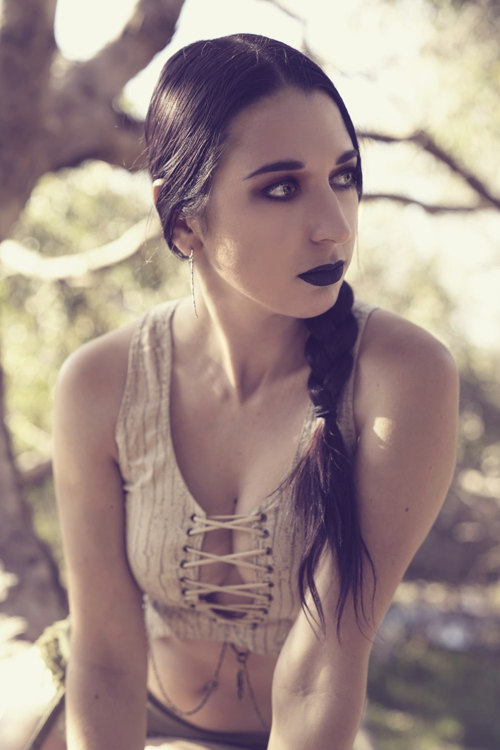 photo of woman wearing beige crop top looking at side