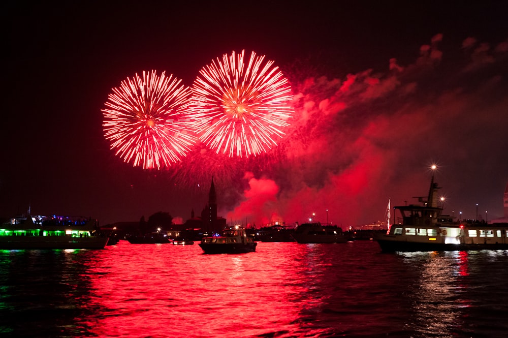 red fireworks during daytime