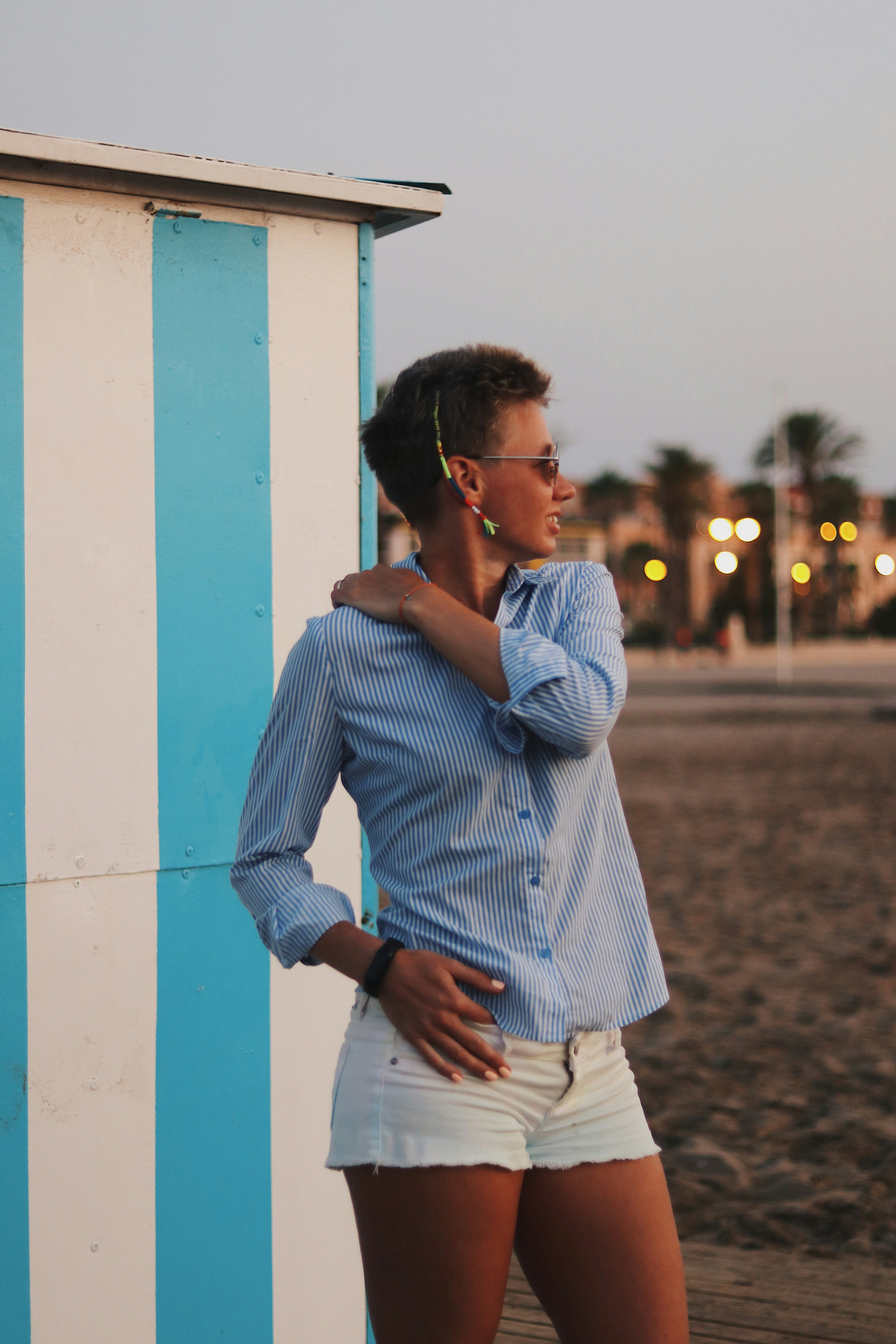 woman holding her shoulder