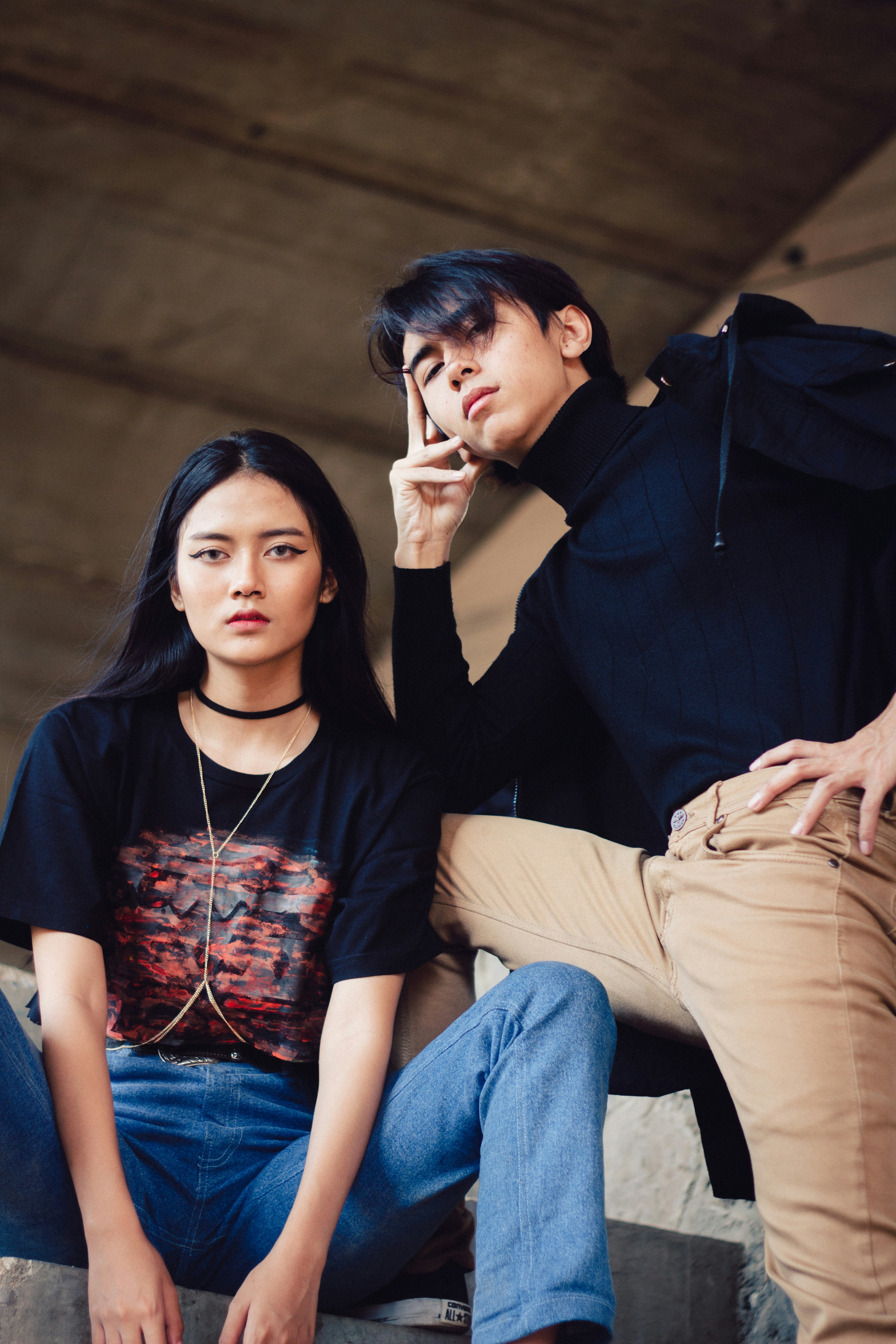 woman sitting beside standing man