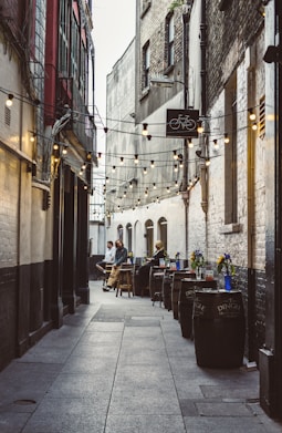narrow street between concrete buildings