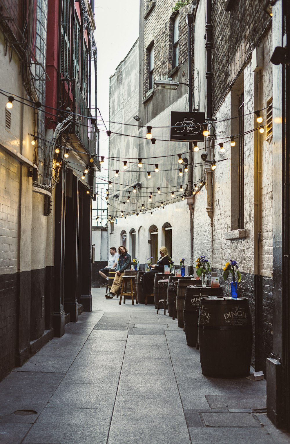 narrow street between concrete buildings