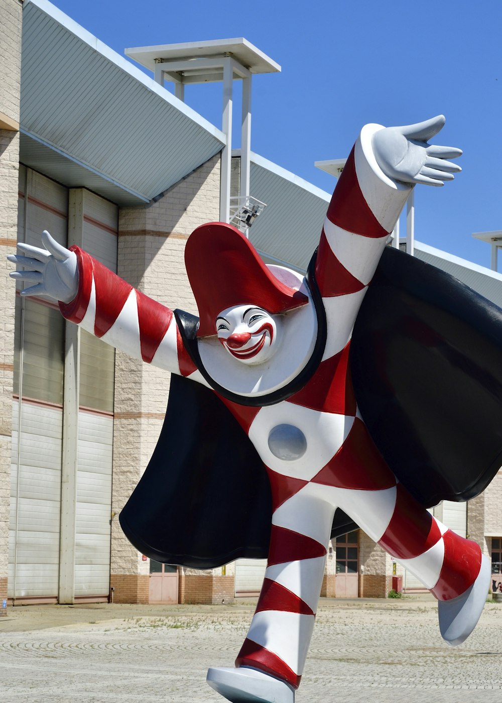 white, red, and black clown statue