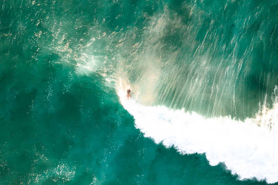 surfing person on huge waves