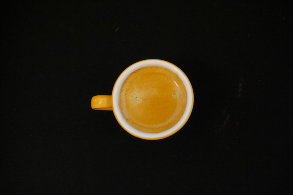 yellow mug with beverage