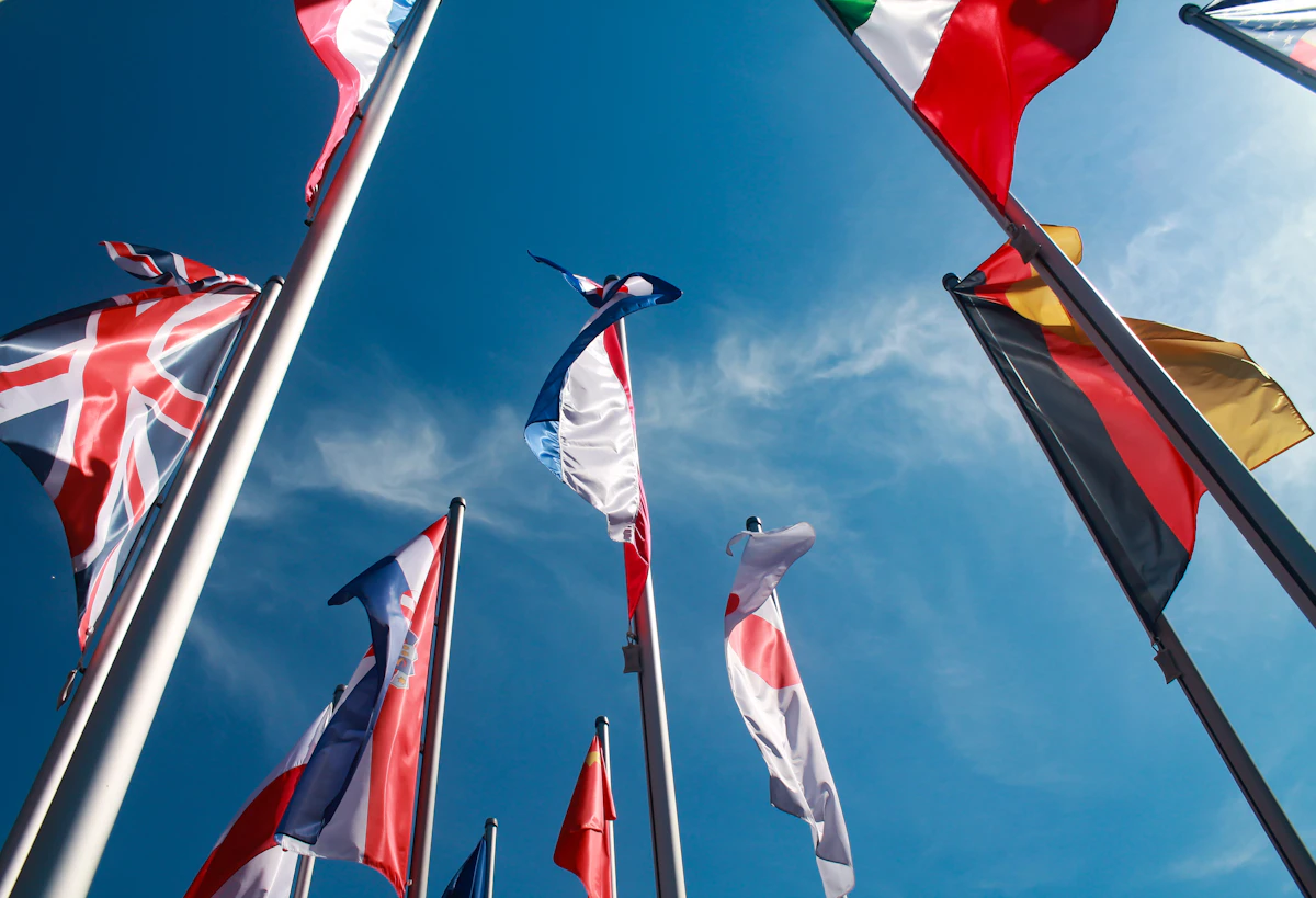 National flags of many countries flying together