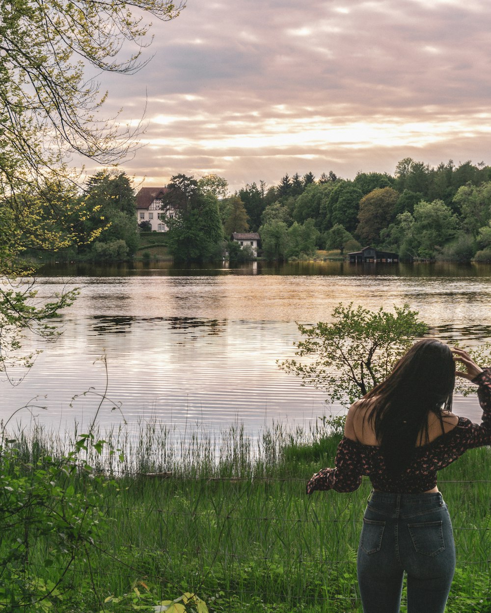 woman standing near lake