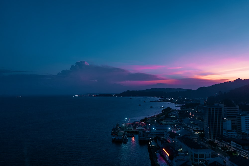 cityscape facing ocean during golden hour