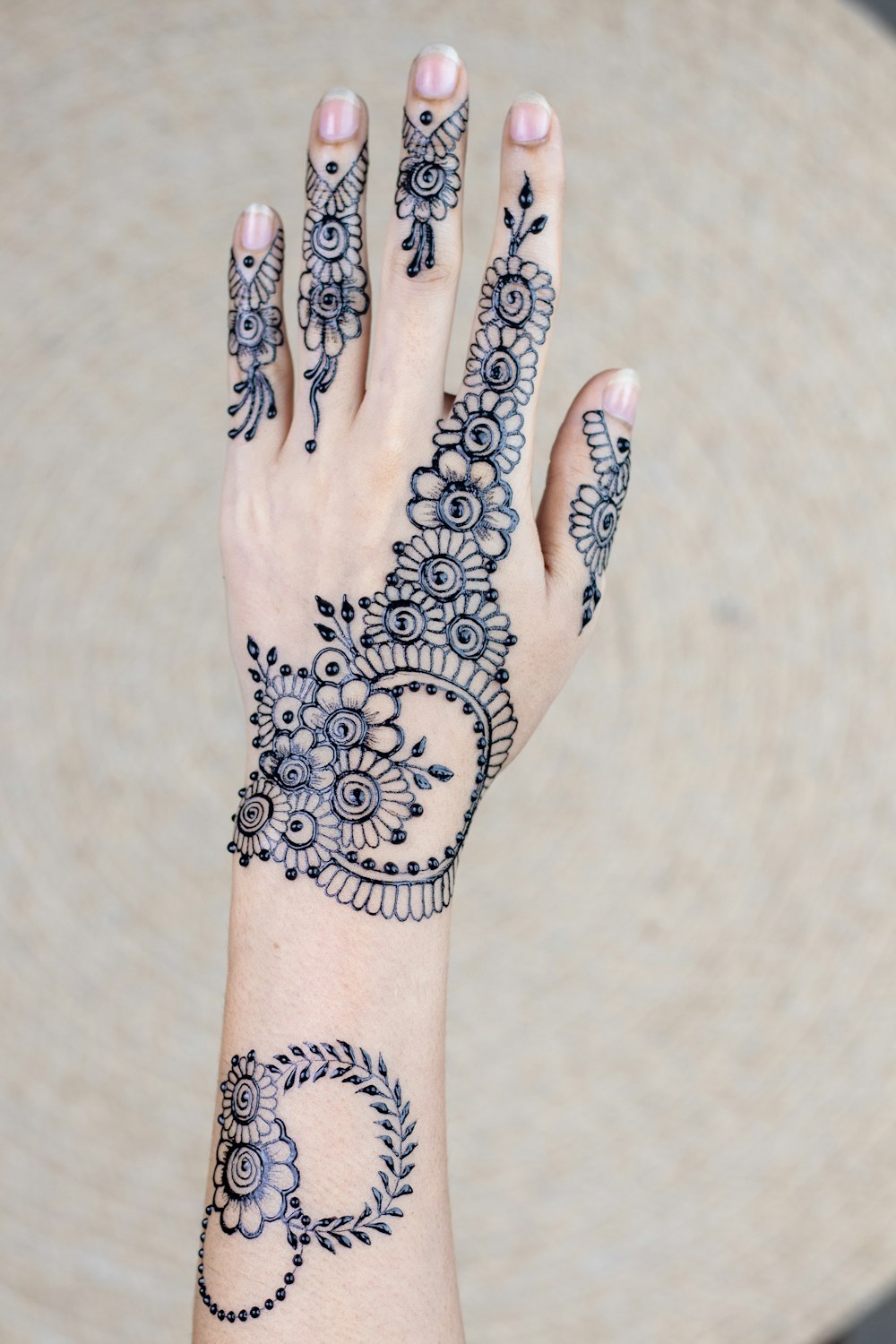 Left Hand With Mehndi Tattoo Photo Free Skin Image On Unsplash
