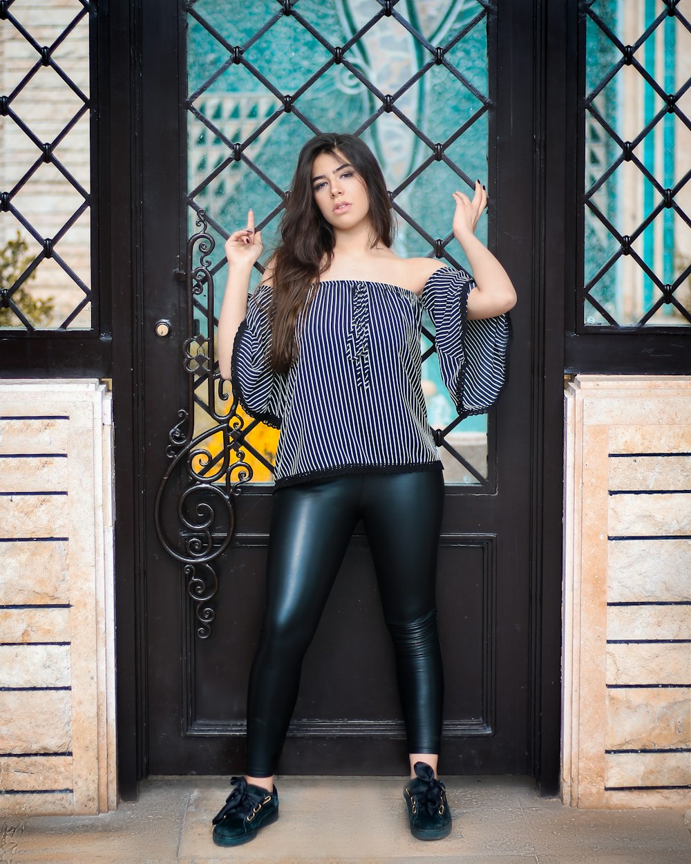 woman leaning on mesh door