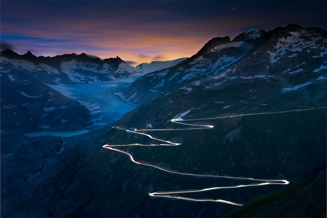 snow covered mountains and road